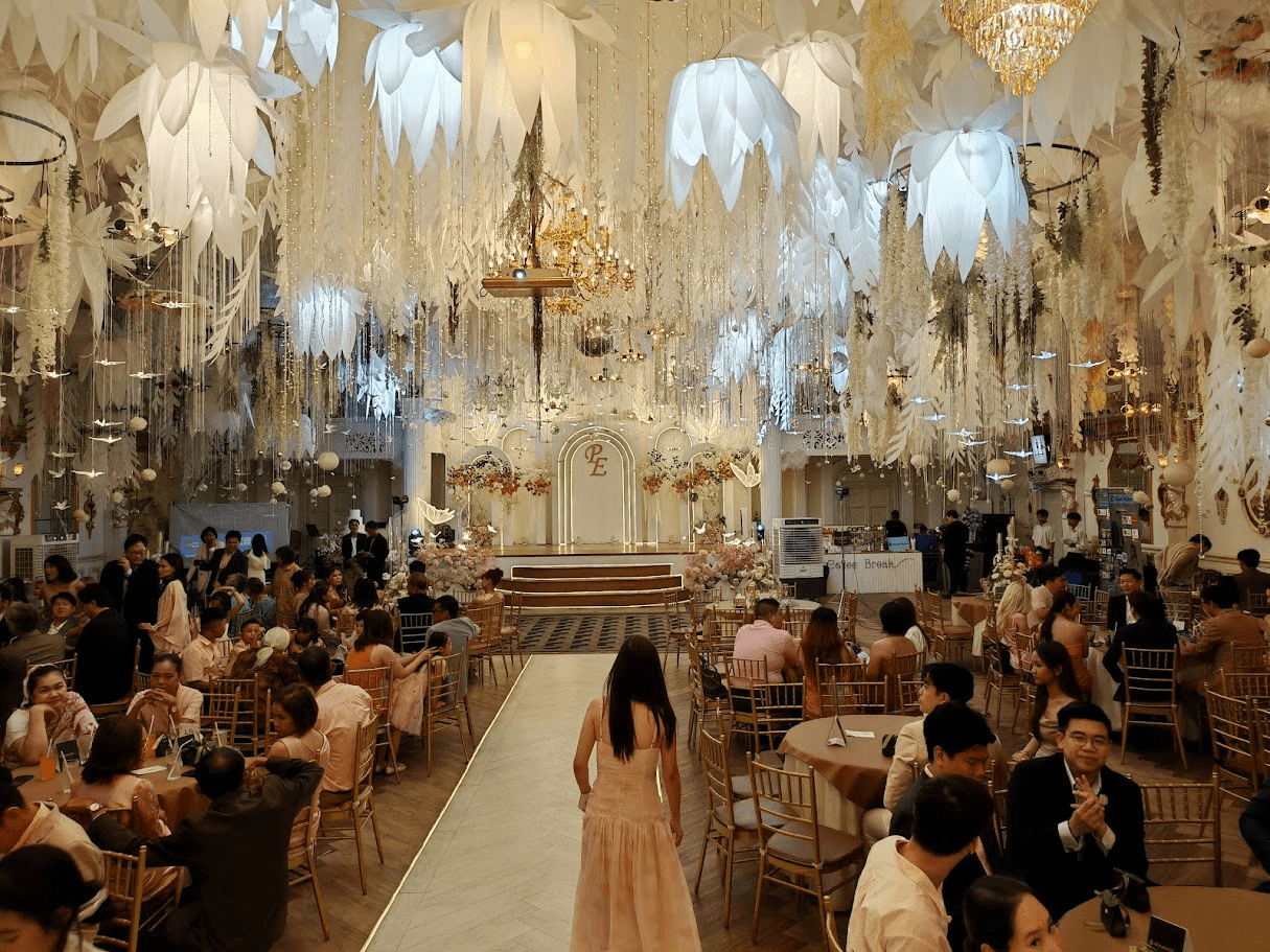 Wide shot of the Vivace venue, ceiling decorations and round tables