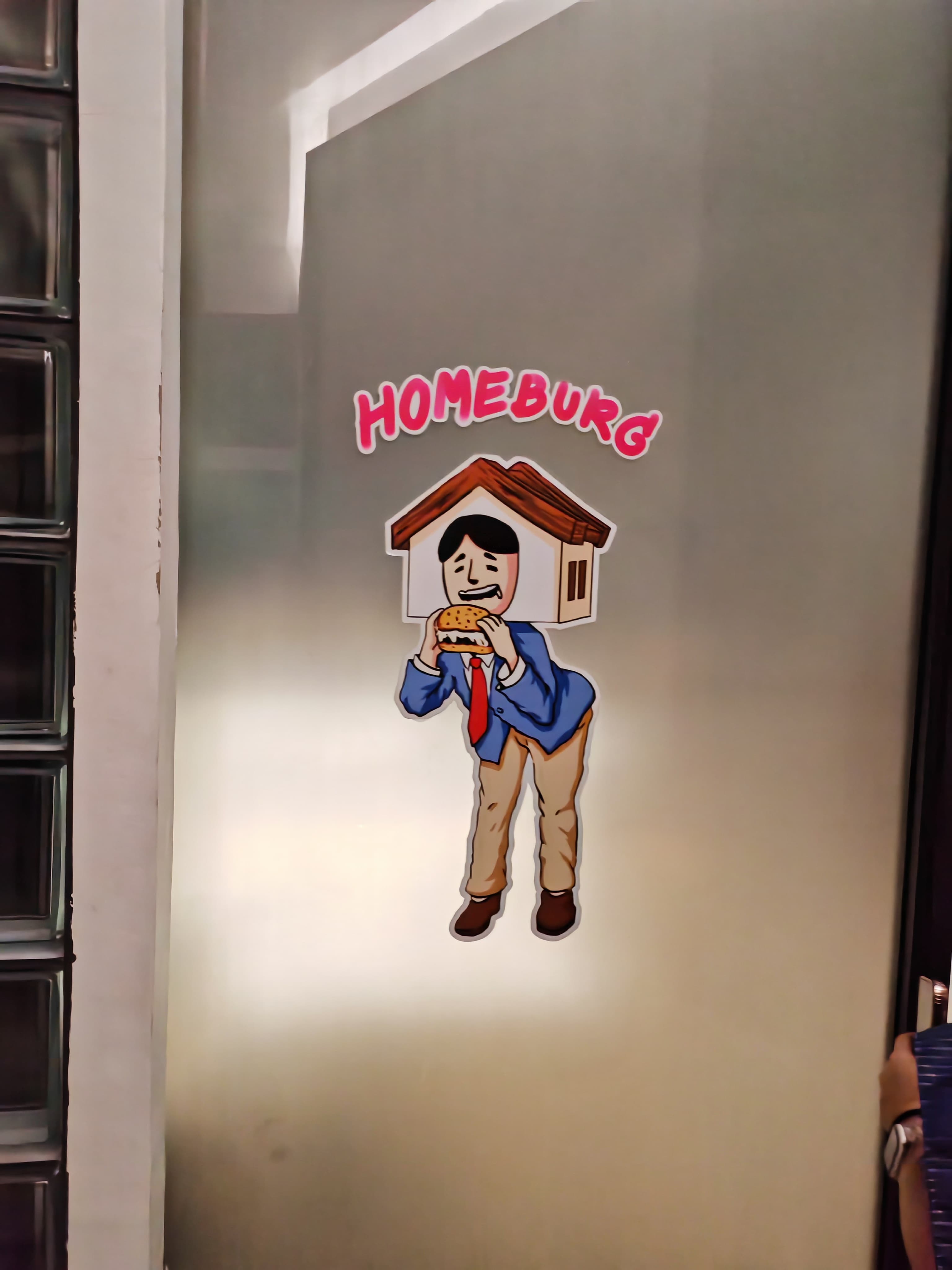 Homeburg mascot logo on the stairwell wall